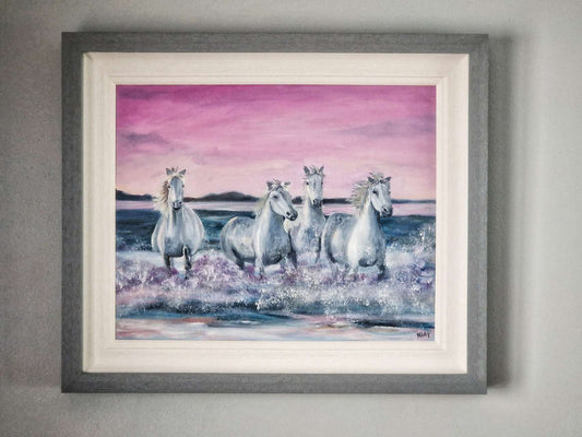 original oil painting of white wild horses running and splashing through the sea. painting by Margaret Rattigan