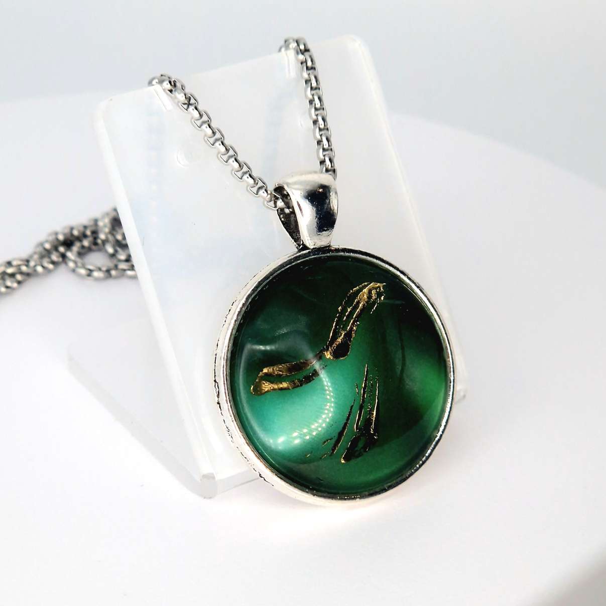 deep green circular glass Art pendant. 25mm hand finished with gold leaf.